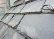 Close up of slate roof tiles on a historic building. Slate is a durable roofing material.